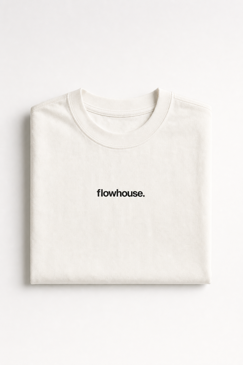 The Core Tee in vintage white — folded flat lay.