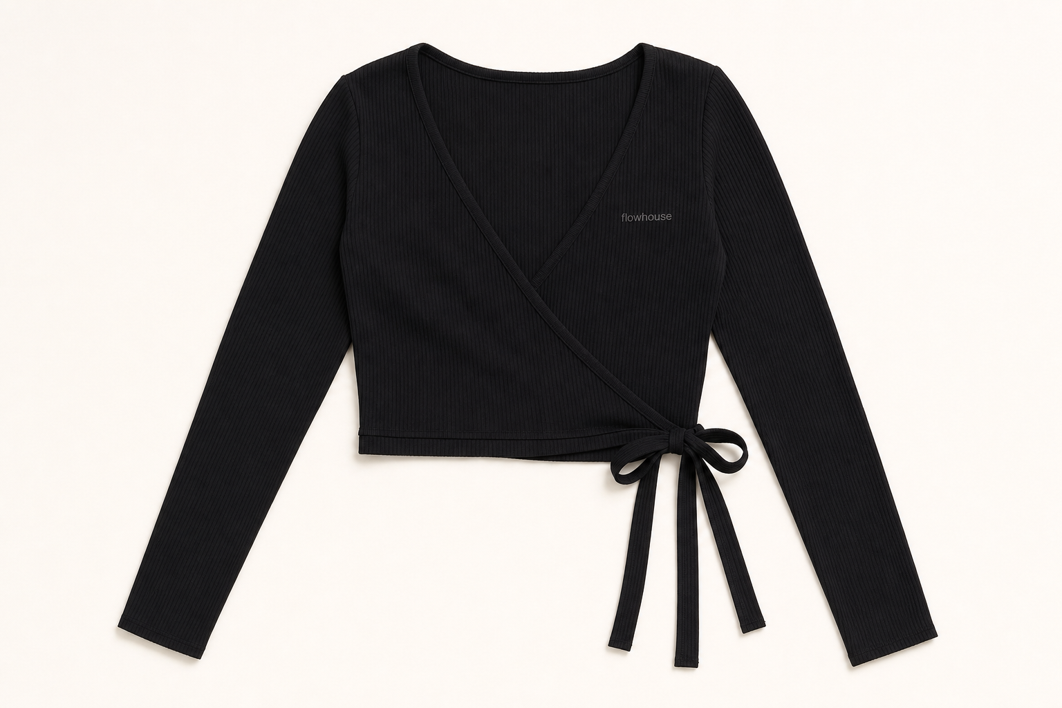 The Studio Wrap long-sleeve in black — flat lay product photograph.